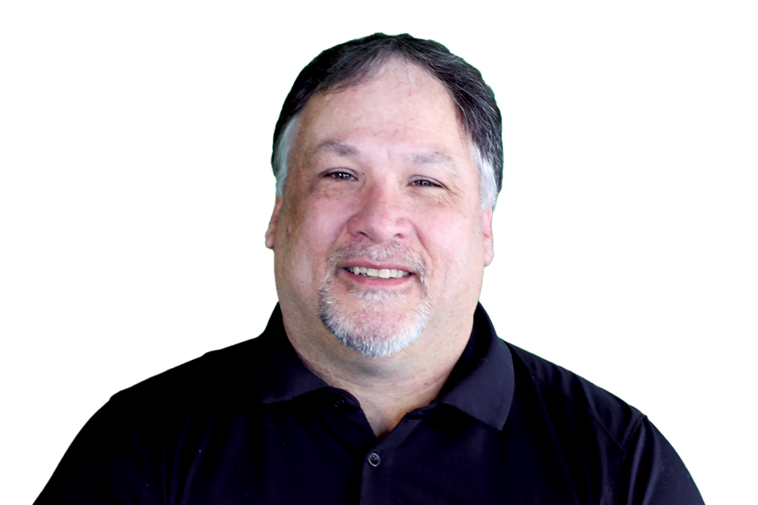 Smiling man in a black shirt with a green background